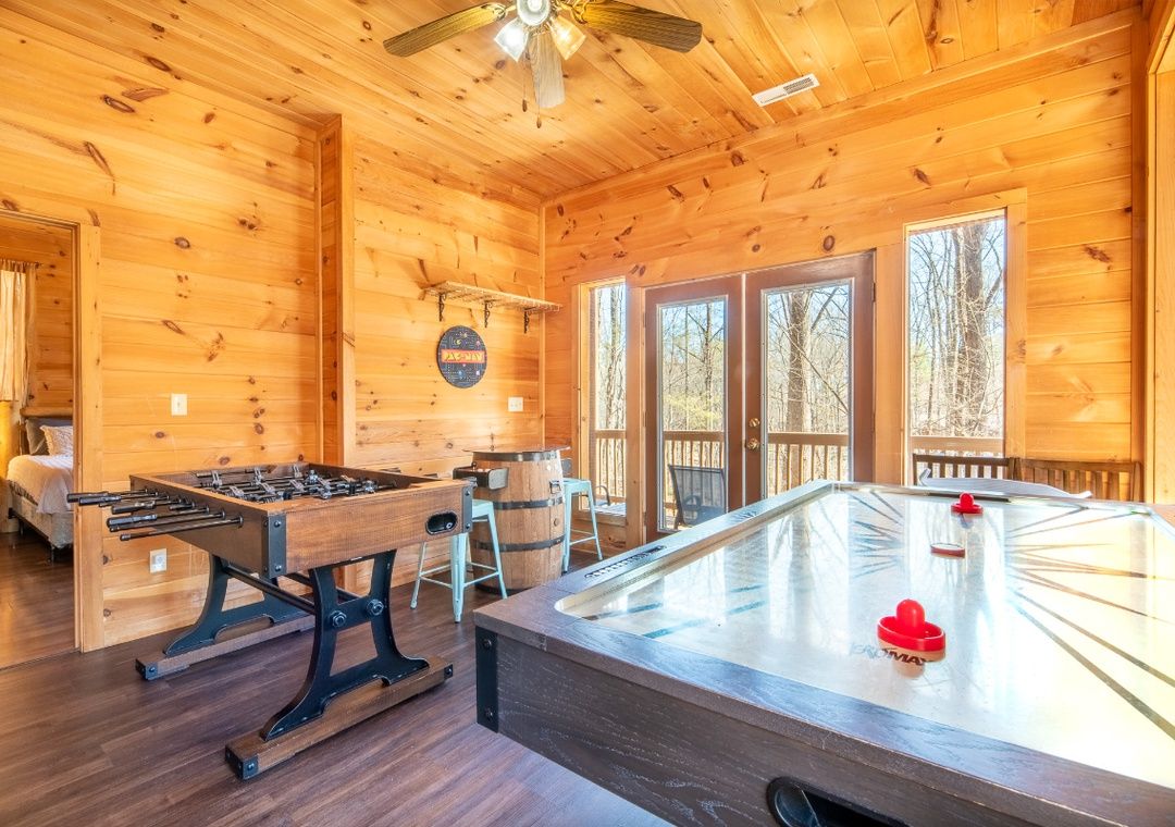 Air hockey table and game room inside Smoky Summit Stays