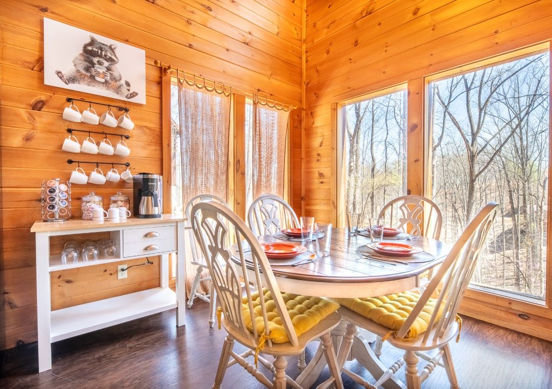 Covered deck dining area with mountain cabin wood ceiling