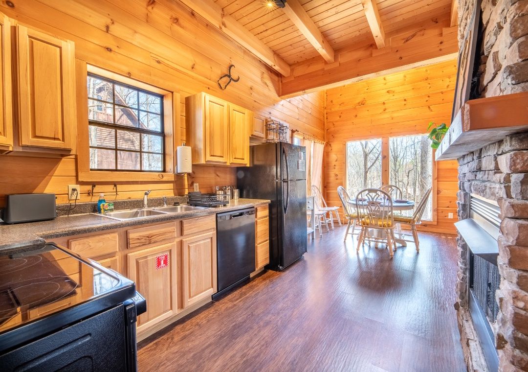 Open kitchen and living space inside Smoky Summit Stays